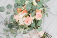 25 a simple wedding bouquet with blush and coral roses and eucalyptus with blush ribbons is a simple and cute piece