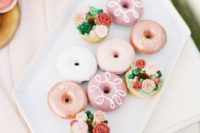 25 glazed donuts and donuts decorated with icing flowers and greenery look super cute and fun