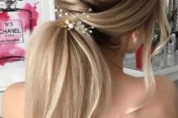 26 a twisted low ponytail with a volume, some locks down and a pretty hairpiece with crystals