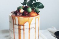26 caramel drizzle semi naked wedding cake topped with citrus, cherries and fresh leaves for a summer wedding