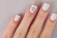26 white matte nails with gold chevrons for a modern or boho bride