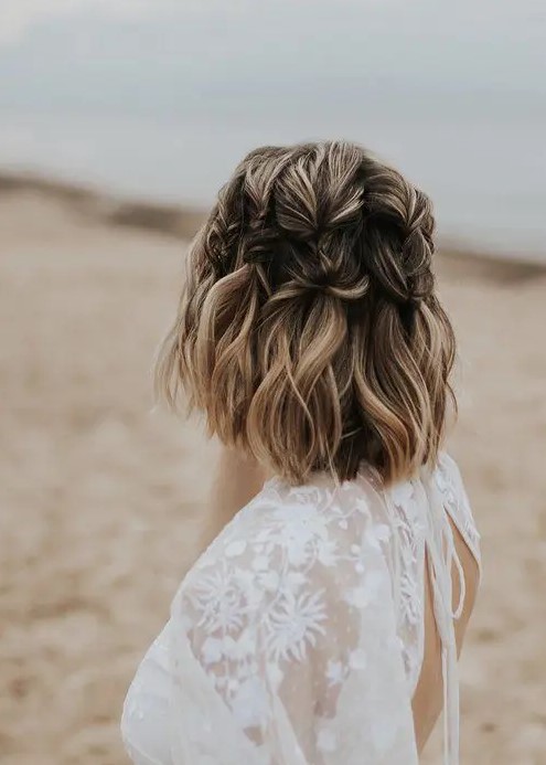 a chic medium half updo with large vertical braids and blonde balayage is a catchy idea for a boho bride