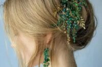 a cool updo with some mess and texture, with locks down and a jaw-dropping gold and emerald hairpiece is wow