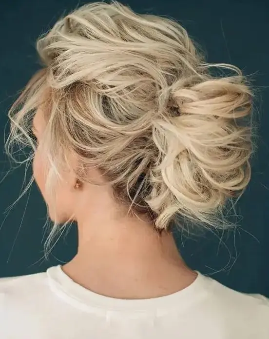 a super messy wedding updo for medium hair with no accessories is a lovely idea for a destination bride who doesn't want to puzzle over her hair