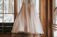 02 The bride was wearing a beautiful blush off the shoulder A-line wedding gown with a long train and an embellished bodice