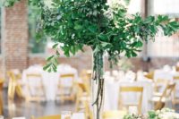 02 a lush greenery centerpiece of branches and leaves is a chic idea to stand out without any blooms