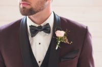 02 a stylish take on a tuxedo look – a burgundy tux with black lapels and a black vest