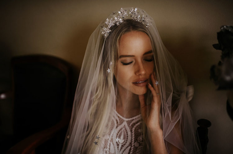The bride was wearing a stunning celestial inspired headpieces with a veil