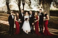 03 The groom and groomsmen were wearign black tuxedos, and the bridesmaids were rocking burgundy mermaid dresses and faux fur scarves