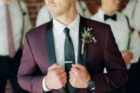 03 a burgundy tuxedo with black lapels and a black tie for a colorful touch