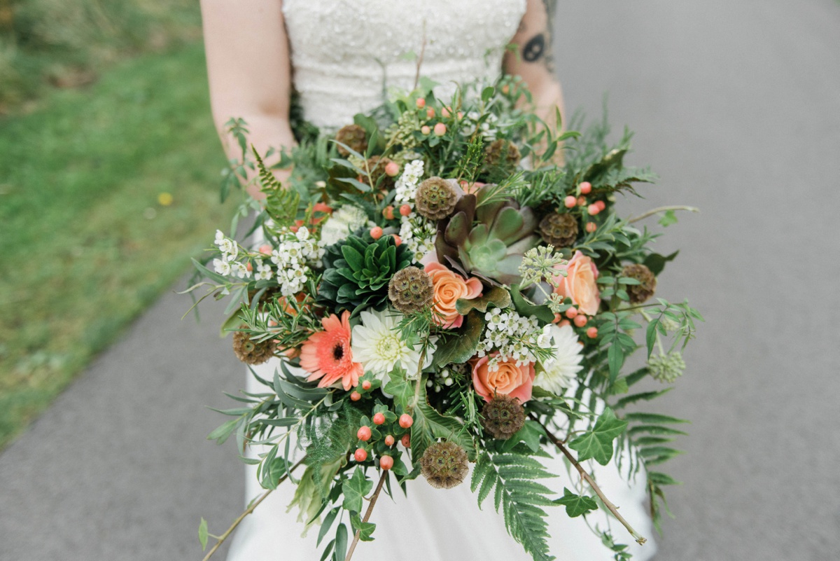 The bridal bouquet was done with succulents, ferns and peachy blooms