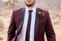 05 a burgundy groom’s suit with black lapels, a black tie and a white shirt for a fall feel