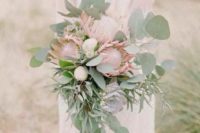 05 a delicate wedding bouquet with eulcayptus, king proteas and succulents for a textural and bold look