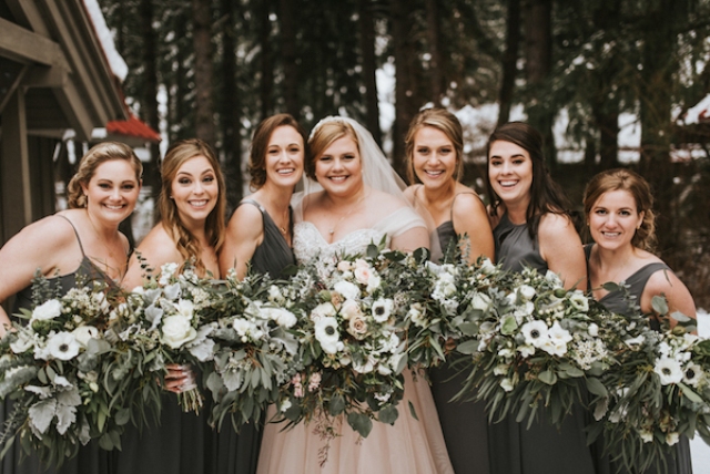 The bridesmaids were wearing mismatching maxi dresses in graphite grey