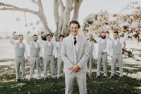 The groomsmen were rocking light grey suits with vests