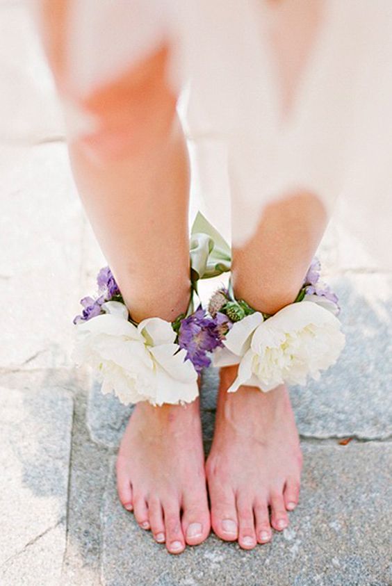 lush floral anklets with ivory and purple blooms will add a romantic feel and are ideal for a garden bride