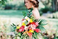 07 a bold bouquet with tropical leaves, red and yellow blooms and an eye-catchy shape