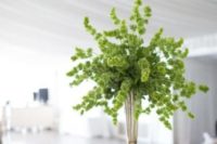 07 a bold greenery wedding centerpiece in a silver vase is a chic and organic idea to rock