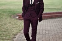 07 a gorgeous three-piece plum-colored suit with a narrow striped tie, black shoes and a white shirt