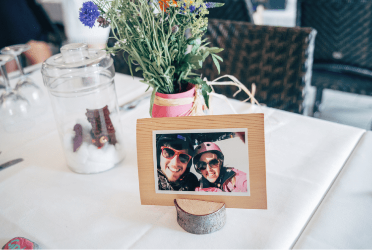 The wedding tablescapes were done with wildflowers, DIY centerpieces in jars and personal pics of the couple