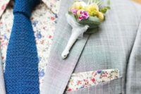 08 a grey windowpane suit, a floral shirt and handkerchief, a bold blue tie