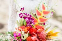 09 a unique bouquet with greenery, fuchsia, orange and red blooms and a catchy dimension