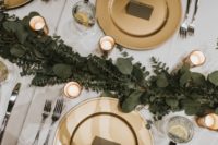 10 Gold chargers and eucalyptus table runners added glam to the space