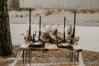 10 The table was styled with a textural centerpiece, black geometric candle holders, black chargers and plates