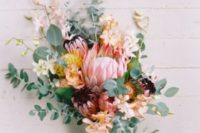 10 a chic and textural bouquet with king proteas, eucalyptus, blush and white blooms for a lush look