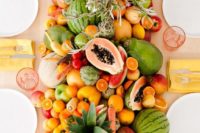 10 a super lush table runner of every kind of tropical fruit wows and can be eaten by the guests