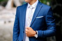 12 a bold blue suit, a white shirt, a floral print tie for a whimsy touch