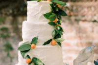 14 The wedding cake was a simple white one with kumquats