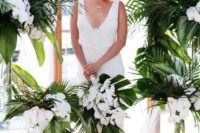 14 a chic tropical bouquet with white orchids and tropical leaves is a timeless idea