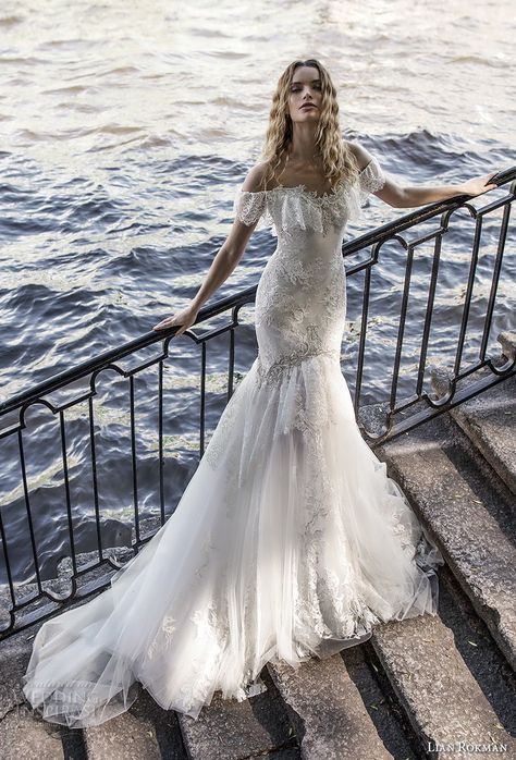 an off the shoulder sweetheart neckline mermaid wedding dress with lace, embellishments and a chapel train