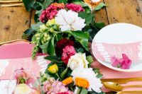16 a colorful and lush tropical table runner of greenery and white, pink and burgundy blooms for a vibrant touch