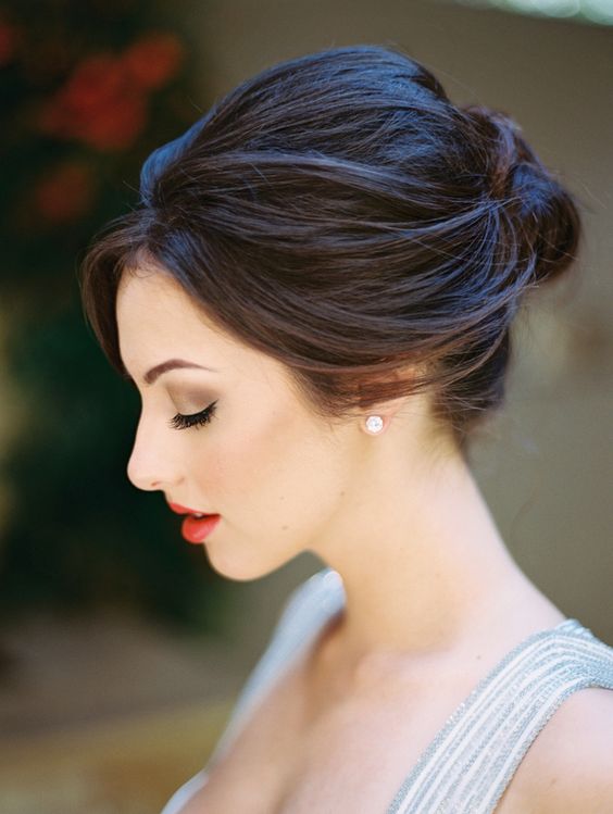 a modern and chic wedidng updo with a textural bump on top looks very sexy and cool
