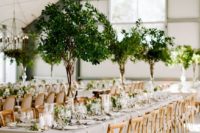 17 such tall foliage centerpieces remind of real trees and bring an organic feel to the space making it outdoorsy]