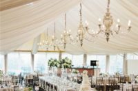 19 taupe tablecloths and drapings hanging from above plus chandeliers in the same shade for a timelessly elegant look