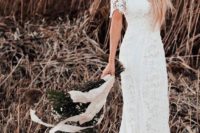 20 a lace sheath of the shoulder wedding dress with a train is ideal for a boho bride