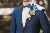 20 a navy suit, a white shirt and a matching whimsy floral bow tie for a quirky touch