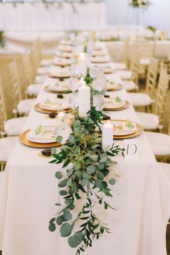 a greenery, foliage and moss wedding table runner is a very refreshing idea for any wedding