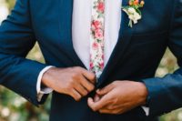 21 a navy suit, a white shirt plus a pink florla print tie for a bright and cheerful summer wedding look