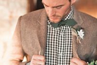 22 a checked shirt, a brown woolen jacket, a dark green bow tie for a woodland fall groom
