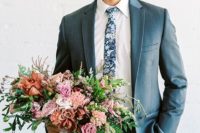 22 a slate grey suit, a white shirt, a dark floral tie for a fresh summer look