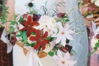 23 a lush cascading bouquet with large burgundy and white blooms, thistles and greenery
