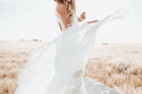 24 a boho bride rocking a white lace dress and a beige hat for a statement