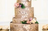 24 a taupe wedding cake with gold touches and bright fresh blooms and greenery for a refined look
