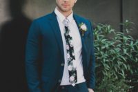 24 a teal wedding suit, a white shirt and a dark floral print tie for a contrasting look