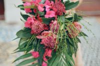 25 a lush cascading wedding bouquet with much greenery and pink flowers of various kinds
