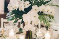 26 palm leaves and white orchids are a classic and chic combo for any wedding